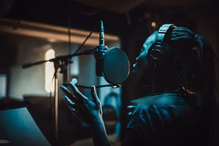 African artist recording music in home studio